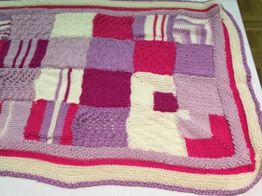 Honey Mitchell - knitted blanket with mitred corners